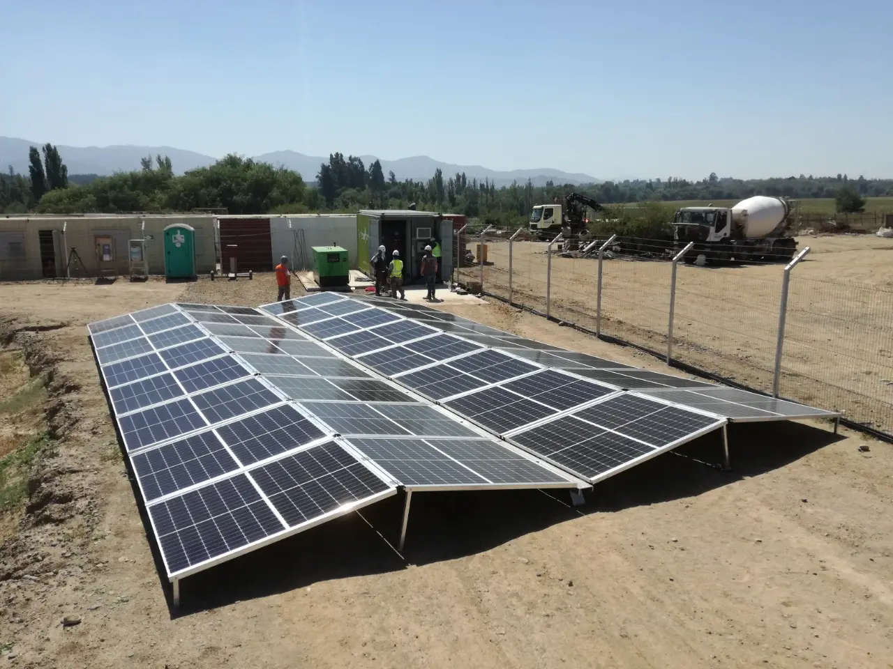 Deployable fold-out photovoltaic array on a Mobil-Grid style container solar plant
